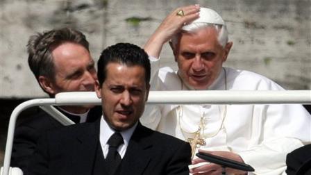 FILE - In this Wednesday, May 31, 2006 file photo Pope Benedict XVI arrives with his then-butler Paolo Gabriele, bottom, and his personal secretary Georg Gaenswein, left, in St. Peters Square at the Vatican. The popes butler has been convicted of stealing the pontiffs private documents and leaking them to a journalist, and has been sentenced to 18 months in prison. Judge Giuseppe Dalla Torre read the verdict aloud Saturday Oct. 6, 2012 one hour after the three-judge panel began deliberating Paolo Gabrieles fate. (AP Photo/Alessandra Tarantino, file)