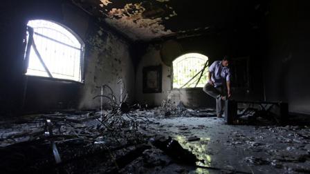 A Libyan man investigates the inside of the U.S. Consulate, after an attack that killed four Americans, including Ambassador Chris Stevens on the night of Tuesday, Sept. 11, 2012, in Benghazi, Libya, Thursday, Sept. 13, 2012. (AP Photo/Mohammad Hannon)