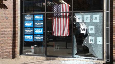 This photo provided by Courtney Grimm shows the shattered glass outside of President Barack Obamas Denver campaign office on Friday, Oct. 12, 2012. Denver police say someone has fired a shot through the window of the campaign office. Police spokeswoman Raquel Lopez says people were inside the office when the shooting happened Friday afternoon, but no one was injured. A large panel of glass was left shattered at the office on West Ninth Avenue near Acoma Street. Lopez says investigators are looking at surveillance video but have not yet confirmed a description of a vehicle that might be linked to the shooting. Police didnt immediately release other details while detectives pursue leads. (AP Photo/Courtney Grimm)