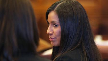 FILE - In this Oct. 9, 2012 file photo, Alexis Wright, 29, turns towards her attorney Sarah Churchill, left, during her arraignment in Portland, Maine on 109 counts of prostitution, violation of privacy, tax evasion and other charges for allegedly providing sex for money at her Kennebunk fitness studio and office. The first batch of more than 100 men accused of paying a fitness instructor for sex were laying low after police began releasing their names in a small New England town where rumors have run rampant for weeks. Police on Monday released 21 names of men who were issued summons for engaging in prostitution with a 29-year-old Zumba instructor whos charged with turning her dance studio into a brothel in this seaside community and secretly videotaping her encounters. (AP Photo/Joel Page, File)