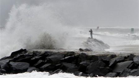 Waves crash onto a jetty in Atlantic City N.J., Sunday, Oct. 28, 2012, as Hurricane Sandy approaches the area. (AP Photo/ Joseph Kaczmarek)