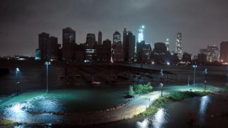 Lower Manhattan goes dark during hurricane Sandy, on Monday, Oct. 29, 2012, as seen from Brooklyn, N.Y. Sandy continued on its path Monday, as the storm forced the shutdown of mass transit, schools and financial markets, sending coastal residents fleeing, and threatening a dangerous mix of high winds and soaking rain. (AP Photo/Bebeto Matthews)