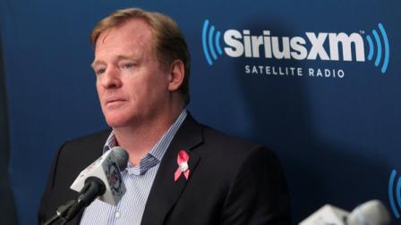 NFL Commissioner Roger Goodell talks with former New York Giant Michael Strahan and football fans during a Sirius XM town hall in New York, Monday, Oct. 22, 2012. (AP Photo/Seth Wenig)