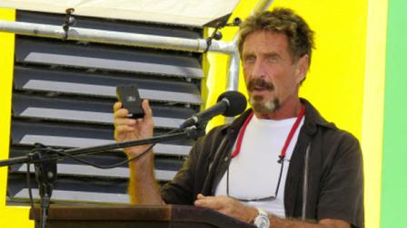In this Thursday Nov. 8, 2012 photo software company founder John McAfee speaks at the official presentation of equipment ceremony that took place at the San Pedro Police Station in Ambergris Caye, Belize. (AP Photo/Ambergris Today Online-Sofia Munoz)