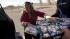Michelle Craft, of Thornton, Colo., loads boxes...