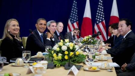 U.S. President Barack Obama, second from left, smiles as he meets with Japans Prime Minister Yoshihiko Noda, right, during the East Asia Summit at the Peace Palace in Phnom Penh, Cambodia, Tuesday, Nov. 20, 2012. Smiling at left is U.S. Secretary of State Hillary Rodham Clinton. (AP Photo/Carolyn Kaster)