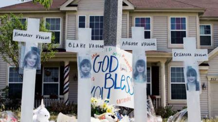 FILE - In this June 15, 2007 file photo, a makeshift memorial to Kimberly Vaughn, and her three children Abigayle, 12, Cassandra, 11, and Blake, 8, is seen outside their home in Oswego, Ill. (AP Photo/Charles Rex Arbogast, File)