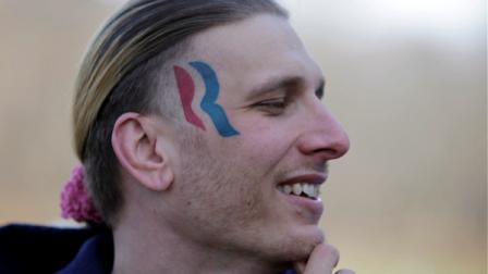 Eric Hartsburg, 30, poses for a photo showing his Romney-Ryan election logo tattoo Friday, Nov. 30, 2012 in Michigan City, Ind. Hartsburg, a professional wrestler, said he hoped the 5-by-2-inch tattoo would make politics more fun and had initially resigned himself to keeping it, but he is now planning to have it removed. (AP Photo/Teresa Crawford)
