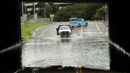 A traffic control vehicle transits a flooded underpass in San Rafael, Calif., on Sunday, Dec. 2, 2012. Days of heavy rains have left the region saturated and several rivers are expected to flood their banks Sunday afternoon. (AP Photo/Noah Berger)
