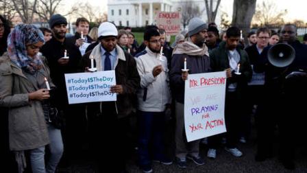 Supporters of gun control gather on Pennsylvania Avenue in front of the White House in Washington, Friday, Dec. 14, 2012, during a vigil for the victims of the shooting at Sandy Hook Elementary School in Newtown, Ct., and to call on President Obama to pass strong gun control laws. (AP Photo/Charles Dharapak)