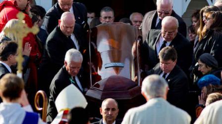 The casket of teacher Anne Marie Murphy, who was killed at the Sandy Hook Elementary School shootings in Newtown, Conn., is lifted from St. Mary Of The Assumption Church after a funeral service in Katonah, N.Y. Thursday, Dec. 20, 2012. Murphy died when Adam Lanza, walked into Sandy Hook Elementary School in Newtown, Dec. 14, and opened fire, killing 26 people, including 20 children, before killing himself. (AP Photo/Craig Ruttle)