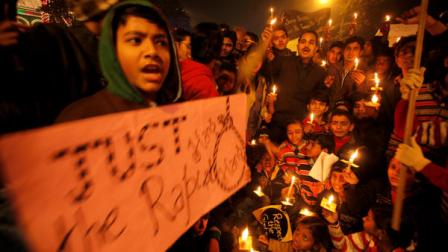 People protesting against the brutal gang-rape of a woman on a moving bus last week in New Delhi, hold candles during a protest in Allahabad, India, Tuesday, Dec. 25, 2012. Authorities shut down roads in the heart of Indias capital for the second consecutive day on Tuesday to put an end to a week of demonstrations against the gang-rape.