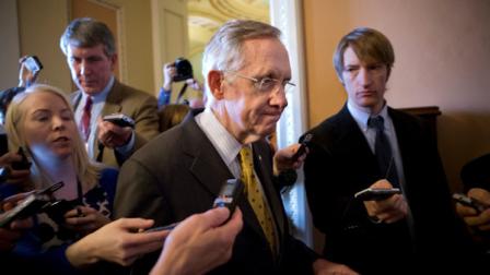 Senate Majority Leader Harry Reid, D-Nev., walks to a closed-door meeting with fellow Democrats as he and Senate Minority Leader Mitch McConnell, R-Ky., work to negotiate a legislative path to avoid the so-called fiscal cliff, at the Capitol in Washington, Sunday, Dec. 30, 2012. Senate and House leaders are rushing to assemble a last-ditch agreement to stave off middle-class tax increases and possibly delay steep spending cuts in an urgent attempt to find common ground after weeks of gridlock. (AP Photo/J. Scott Applewhite)
