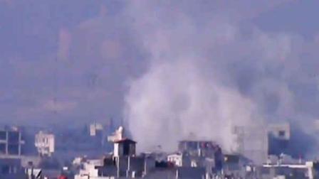 In this image taken from video obtained from the Shaam News Network, smoke rises from buildings due to heavy shelling in Damascus countryside, Syria, on Wednesday, Jan. 2, 2013. (AP Photo/Shaam News Network via AP video)