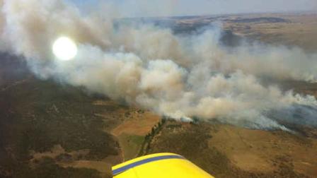 In this photo provided by the New South Wales Rural Fire Service, plumes of smoke rise from a fire near Cooma, Australia, Tuesday, Jan. 8, 2013. Temperatures across much of New South Wales state are expected to reach 45 degrees Celsius (113 degrees Fahrenheit) causing extreme conditions. (AP Photo/New South Wales Rural Fire Service)