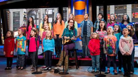 Ingrid Michaelson accompanied by children from Newtown, Conn. and Sandy Hook Elementary school perform Somewhere Over the Rainbow on ABCs Good Morning America on Tuesday, Jan. 15, 2013 in New York. (Photo by Charles Sykes/Invision/AP)