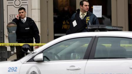 Police investigate outside the scene of a shooting Tuesday, Jan. 15, 2013, in St. Louis. Police say a gunman walked into the Stevens Institute of Business and Arts business school in downtown St. Louis and shot an administrator in the chest before shooting himself. (AP Photo/Jeff Roberson)