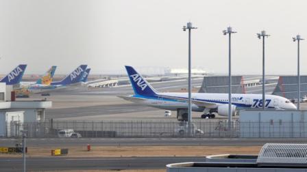 All Nippon Airways planes including a Boeing 787, right, are parked at Haneda Airport in Tokyo Wednesday afternoon, Jan. 16, 2013. (AP Photo/Shizuo Kambayashi)