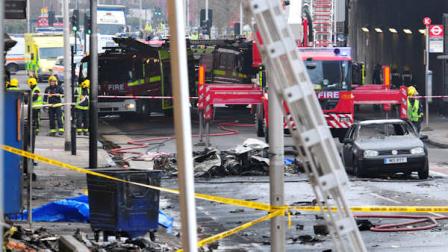 Debris lies on the ground after a helicopter crashed into a construction crane on top of St Georges Wharf tower building, in London, Wednesday Jan. 16, 2013. Police say two people were killed when a helicopter crashed during rush hour in central London after apparently hitting a construction crane on top of a building. (AP Photo/Vince Pol)
