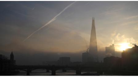 The Shard skyscraper is seen through early morning fog from a bridge over the river Thames just after sunrise in London, Wednesday, Dec.12, 2012. .(AP Photo/Alastair Grant)