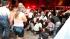 People help an injured man, victim of a fire in...
