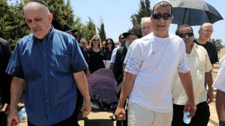 FILE - In this July 20, 2012 file photo, relatives carry the body Kochava Shriki, 44, in Rishon Lezion, Israel, two days after she was killed in a suicide bombing in Bulgaria. Officials have blamed the attack on Hezbollah. Irans elite Quds Force and Hezbollah militants are learning from a series of botched terror attacks over the past two years and pose a growing threat to the U.S. and other Western targets as well as Israel, a prominent counterterrorism expert says. The terror plot in Bulgaria suggests that militants may be learning from their missteps. (AP Photo/Tsafrir Abayov, file)