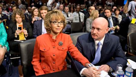 Former Arizona Rep. Gabrielle Giffords, who was seriously injured in the mass shooting that killed six people in Tucson, Ariz. two years ago, sits with her husband, Mark Kelly, right, a retired astronaut, on Capitol Hill in Washington, Wednesday, Jan. 30, 2013, prior to speaking before the Senate Judiciary Committee hearing on what lawmakers should do to curb gun violence in the wake of last months shooting rampage at that killed 20 schoolchildren in Newtown, Ct. (AP Photo/J. Scott Applewhite)