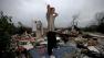 Will Carter, 15, surveys the damage to his house upon arriving home from school following a tornado, Wednesday, Jan. 30, 2013, in Adairsville, Ga. (AP Photo/David Goldman)  