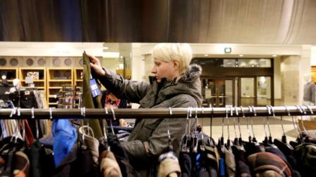 A woman shops at Nordstrom store in Chicago, Thursday, Jan. 10, 2013.The nations consumers, enticed by bitter cold weather, shopped the winter clearance racks with gusto in January, resulting in strong sales for a diverse group of retailers. But analysts expect shoppers, particularly those in the low income to middle income bracket, to pull back in the weeks ahead as they digest rising gas prices and a new payroll tax hike. (AP Photo/Nam Y. Huh)
