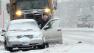 A snow plow waits for a man to move his vehicle during a city parking ban as snow falls in East Hartford, Conn., Friday, Feb. 8, 2013. Snow began to fall as a massive blizzard headed for the American Northeas, sending residents scurrying to stock up on food and supplies ahead of a storm poised to dump up to 3 feet of snow from New York City to Boston and beyond. (AP Photo/Jessica Hill)