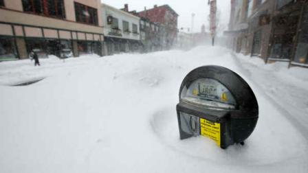 A parking meter pokes out of a snow bank during a blizzard, Saturday, Feb. 9, 2013, in Portland, Maine. The storm dumped more than 30 inches of snow as of Saturday afternoon, breaking the record for the biggest storm on record. (AP Photo/Robert F. Bukaty)