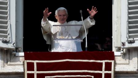 Pope Benedict XVI waves to the faithful during the Angelus noon prayer he celebrated from the window of his studio overlooking St. Peters square at the Vatican, Sunday, Feb. 17, 2013. Pope Benedict XVI blessed the faithful for the first time since announcing his resignation, cheered by an emotional crowd of tens of thousands of well-wishers from around the world. (AP Photo/Alessandra Tarantino)