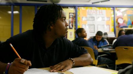 FILE: Dontike Miller, 23, works on math problems at the YouthBuild Public Charter Schools GED program in Washington, Thursday Oct. 25, 2007. (AP Photo/Jacquelyn Martin)