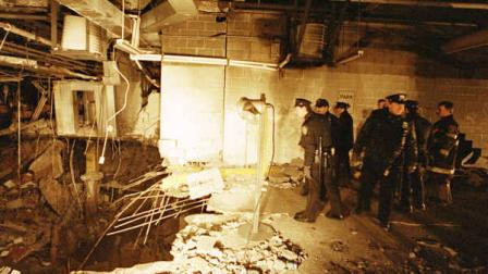 **FILE** New York City police and firefighters inspect the bomb crater inside the World Trade center in this Feb. 27, 1993 file photo on the day after the attack. With the attacks 15th anniversary approaching, the days before the bomb blast appear to mark the last time when millions of Americans went about their business, unaware of the dangers posed by international terrorism. (AP Photo/Richard Drew, File)