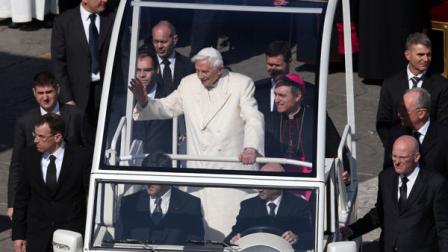 Pope Benedict XVI greets pilgrims at the end of his general audience in St. Peters Square at the Vatican, Wednesday, Feb. 27, 2013. Pope Benedict XVI basked in an emotional sendoff Wednesday at his final general audience in St. Peters Square, recalling moments of joy and light during his papacy but also times of great difficulty. He also thanked his flock for respecting his decision to retire. (AP Photo/Luca Bruno)