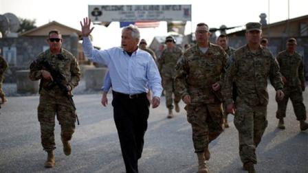 U.S. Secretary of Defense Chuck Hagel walks to his military aircraft after visiting members of the 101st Airborne Division at Jalalabad Airfield in eastern Afghanistan on Saturday, March 9, 2013. This is Hagels first trip to Afghanistan as defense secretary. (AP Photo/Pool, Jason Reed)