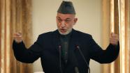 Afghan President Hamid Karzai gestures during a joint press conference with Pakistans Prime Minister Yusuf Raza Gilani, unseen, at the presidential palace in Kabul, Afghanistan on Saturday, Dec 4, 2010. (AP Photo/Musadeq Sadeq)  