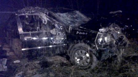 This Sunday, March 10, 2013 photo shows a Honda Passport that crashed into a guardrail and flipped over into a swampy pond Sunday morning in Warren, Ohio. Highway Patrol officials say speed was a factor in the violent early morning crash of the vehicle that killed six teenagers in northeast Ohio. (AP Photo/Tom Sheeran)