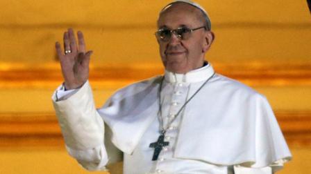 Pope Francis waves to the crowd from the central balcony of St. Peters Basilica at the Vatican, Wednesday, March 13, 2013. Cardinal Jorge Bergoglio who chose the name of Francis is the 266th pontiff of the Roman Catholic Church. (AP Photo/Gregorio Borgia)