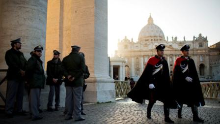 Security guards patrol in St. Peters Square at the Vatican, Monday, March 18, 2013. a day before the inaugural Mass of Pope Francis. The Vatican released details of the popes installation Mass on Tuesday as well images of his coat of arms and fishermans ring. In addition to more than 132 government delegations, the Vatican said 33 Christian delegations will be present, as well as representatives from Jewish, Muslim, Buddhist, Sikh and Jain communities. (AP Photo/Oded Balilty)