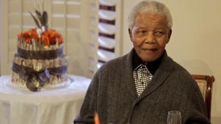 FILE - In this Wednesday, July 18, 2012 file photo former South African President Nelson Mandela as he celebrates his birthday with family in Qunu, South Africa, Wednesday, July 18, 2012. (AP Photo/Schalk van Zuydam)