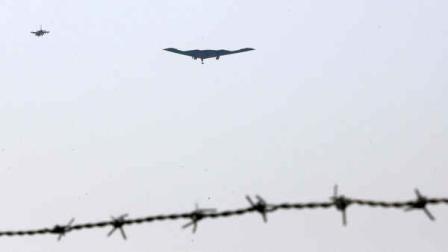 U.S. Air Force B-2 stealth bomber, center, flies over near the Osan U.S. Air Base in Pyeongtaek, south of Seoul, South Korea, Thursday, March 28, 2013. A day after shutting down a key military hotline, Pyongyang instead used indirect communications with Seoul to allow South Koreans to cross the heavily armed border and work at a factory complex that is the last major symbol of inter-Korean cooperation. (AP Photo/Shin Young-keun, Yonhap)