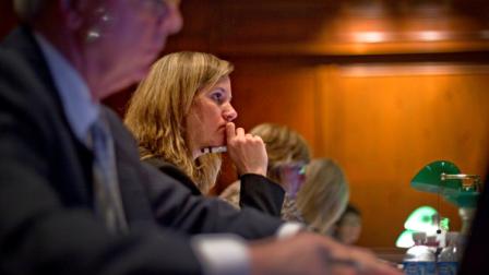 Georgia Professional Standards Commission member Christy McGill listens during a vote to yank the teaching licenses for eight teachers and three school administrators accused in the Atlanta schools cheating scandal Thursday, Oct. 13, 2011 in Atlanta. The commission voted Thursday on the first batch of cases from a state probe that revealed widespread cheating in nearly half of the districts 100 schools as far back as 2001. (AP Photo/David Goldman)