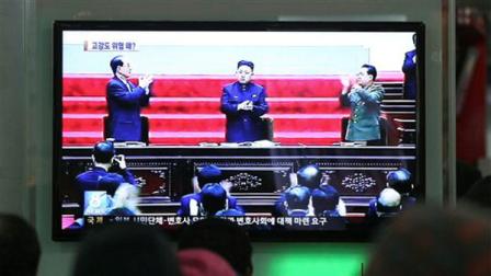 People watch a TV news report showing North Korean leader Kim Jong Un, center, and other leaders, at Seoul Railway Station in Seoul, South Korea, Saturday, March 30, 2013. North Korea warned Seoul on Saturday that the Korean Peninsula was entering a state of war and threatened to shut down a factory complex thats the last major symbol of inter-Korean cooperation.(AP Photo/Ahn Young-joon)