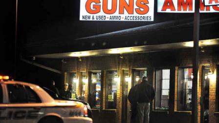 In this Dec. 20, 2012 photo, law enforcement officials stand outside Riverview Gun Sales, as authorities raid the store in East Windsor, Conn. The shop, which sold a gun to Nancy Lanza, mother of Newtown school shooter Adam Lanza, had its federal firearms license revoked by the Bureau of Alcohol, Tobacco, Firearms and Explosives. (AP Photo/Jessica Hill)
