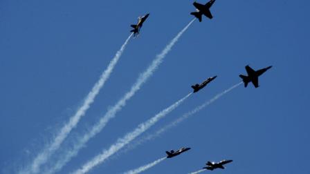 The Blue Angels makes one of their signature maneuvers over Aquatic Park in San Francisco, at an air show as part of Fleet Week in the San Francisco Bay Area, Sunday, Oct. 7, 2007. (AP Photo/Dino Vournas)