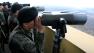 South Korean soldiers look at North Korea through binoculars from Dora Observation Post near the border village of Panmunjom, which has separated the two Koreas since the Korean War, in Paju, north of Seoul, South Korea, Wednesday, April 10, 2013. The prospect of a North Korean missile launch is considerably high, South Koreas foreign minister told lawmakers Wednesday as Pyongyang prepared to mark the April 15 birthday of its founder, historically a time when it seeks to draw the worlds attention with dramatic displays of military power. (AP Photo/Lee Jin-man)  