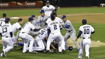 San Diego Padres Carlos Quentin and teammates battle the Los Angeles Dodgers after Quentin was hit by a pitch thrown by Dodgers pitcher Zack Greinke in the sixth inning of baseball game in San Diego, Thursday, April 11, 2013. (AP Photo/Lenny Ignelzi)