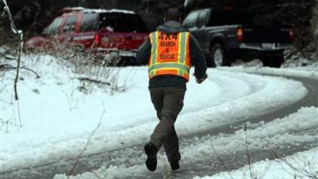 A man with King County Search and Rescue runs toward scene of avalanche at exit 47 along I-90 near Snoqualmie Pass, Sat. April 13, 2013. (Photo by Ken Lambert/The Seattle Times) OUTS: SEATTLE OUT, USA TODAY OUT, MAGAZINES OUT, TELEVISION OUT, SALES OUT. MANDATORY CREDIT TO: KEN LAMBERT / THE SEATTLE TIMES.