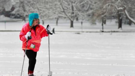 Judy Werner cross country skis on the fresh snow which fell overnight in Denver, Tuesday April 16, 2013. The second wave of a slow-moving Spring storm system could bring another foot of snow to parts of Colorado Tuesday, on top of up to a foot already on the ground. (AP Photo/Brennan Linsley)